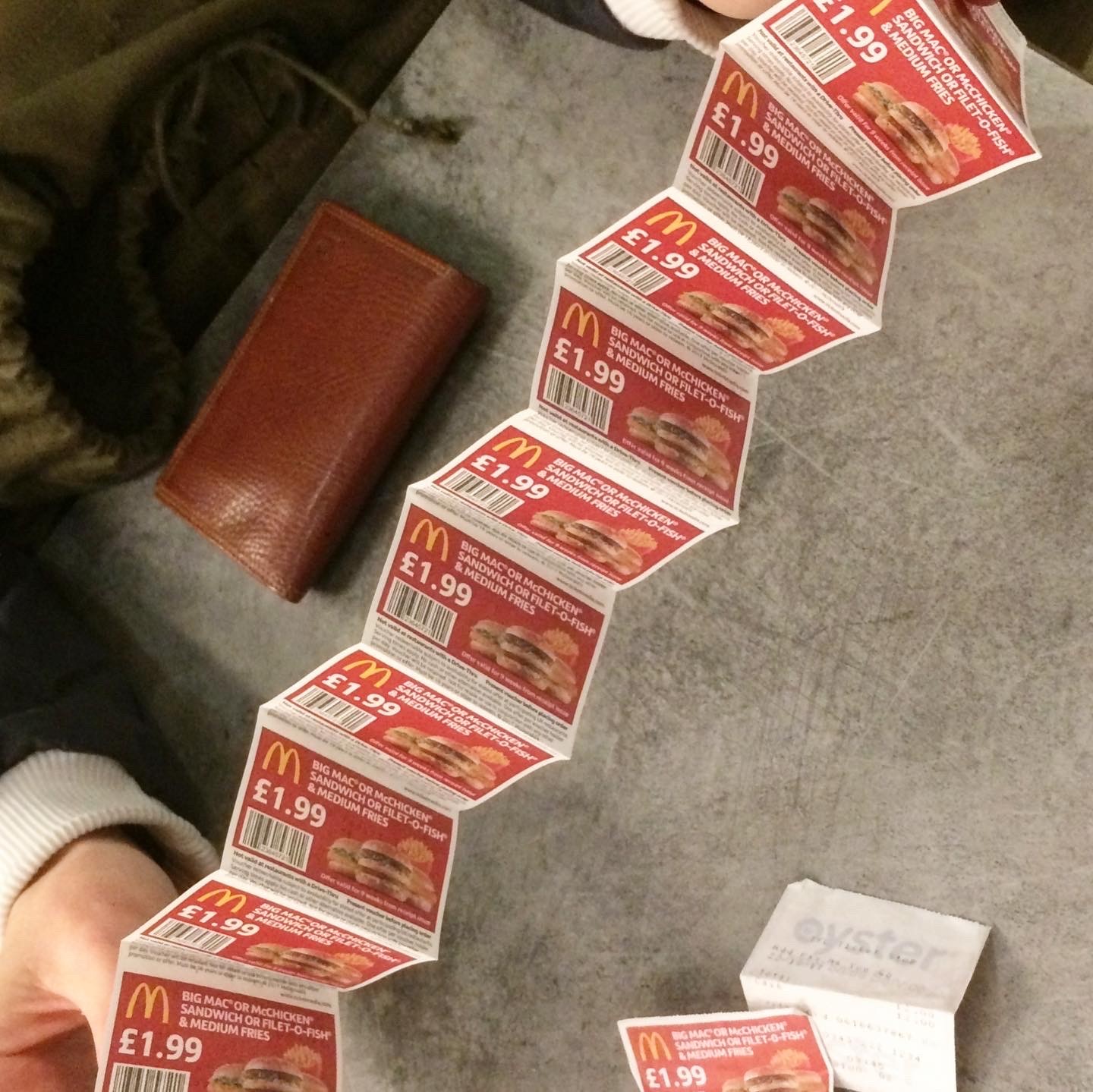 An accordion of McDonald's £1.99 vouchers which used to come on the back of Oyster card receipts or on the pages of the Metro newspaper.
